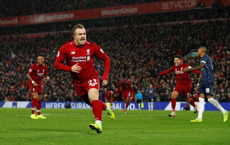 Soccer Football - Premier League - Liverpool v Manchester United - Anfield, Liverpool, Britain - December 16, 2018  Liverpool's Xherdan Shaqiri celebrates scoring their second goal   REUTERS/Phil Noble  EDITORIAL USE ONLY. No use with unauthorized audio, video, data, fixture lists, club/league logos or "live" services. Online in-match use limited to 75 images, no video emulation. No use in betting, games or single club/league/player publications.  Please contact your account representative for further details.