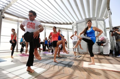 Dubai, June 12, 2013 - Yoga At the Top will be offered at the Burj Khalifa observation deck from June 13, 2013,   and will feature sessions lead by instructors from Fitness First clubs in Dubai, June 12, 2013. (Photo by: Sarah Dea/The National)


 *** Local Caption ***  SDEA120513-burjyoga05.JPG