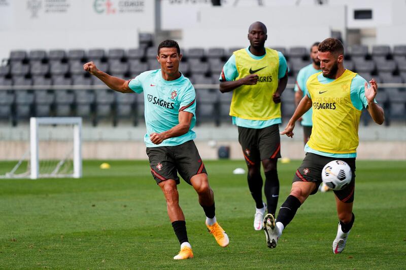 epa08639811 A handout photo made available by the Portuguese Football Federation (FPF) shows Portuguese national soccer players Cristiano Ronaldo (L) and Danilo (C) during the team's training session at Cidade do Futebol in Oeiras, Portugal, 01 September 2020. Portugal will face Croatia on 05 September 2020 in a UEFA Nations League match.  EPA/DIOGO PINTO/FPF/HO  HANDOUT EDITORIAL USE ONLY/NO SALES