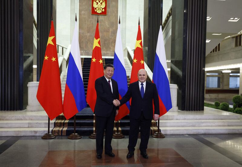 Mr Xi meets Russian Prime Minister Mikhail Mishustin in Moscow. AFP