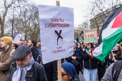 A pro-Palestinian protester holds a sign at London rally, criticising Labour's stance during a call for an immediate and permanent ceasefire in Gaza, on February 17. In Pictures via Getty Images
