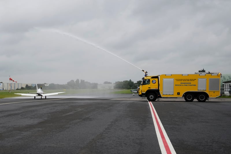 A water canon salute for the Shark Ultralight and Belgian-British teenager Zara Rutherford prior to take off from Belgium. AP Photo