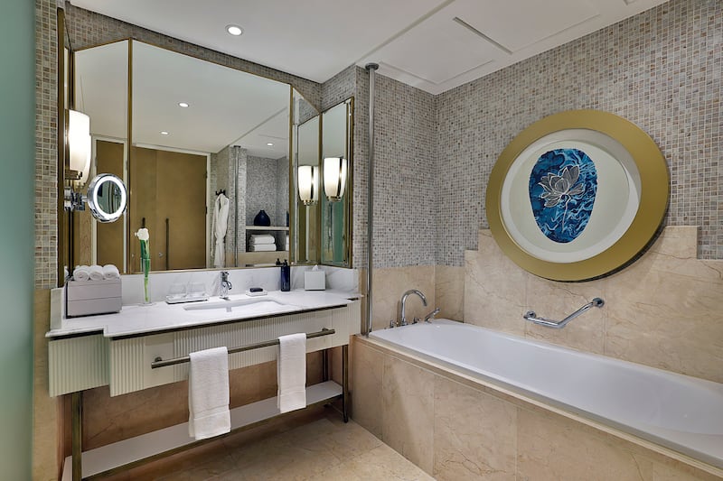Each room comes equipped with a decadently decorated bathroom with a full bathtub, sink and rain shower 