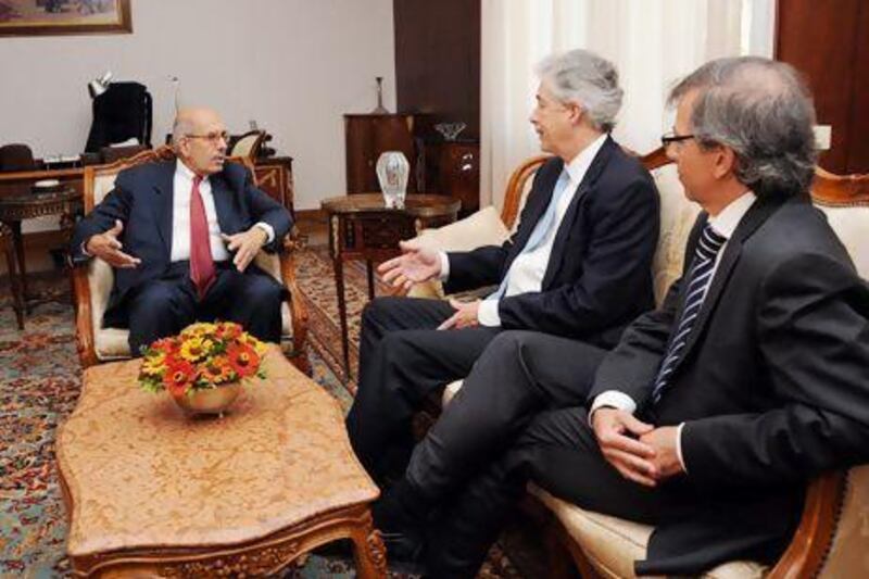 Egypt's vice president Mohamed ElBaradei (right) talks with US deputy secretary of state William Burns (centre) during a meeting at the presidential palace in Cairo.