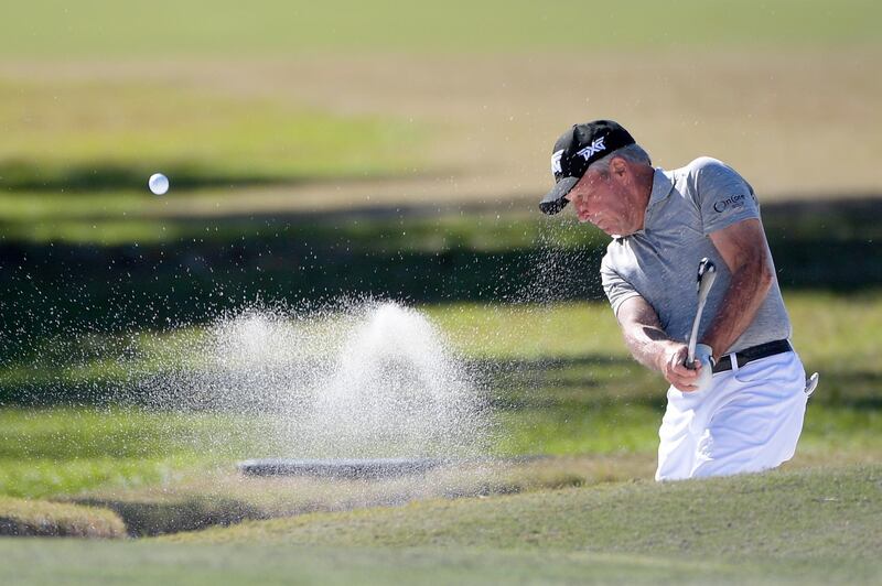 Gary Player hits out of a bunker onto the seventh green during the first round of the Father Son Challenge golf tournament Saturday, Dec. 7, 2019, in Orlando, Fla. (AP Photo/Phelan M. Ebenhack)