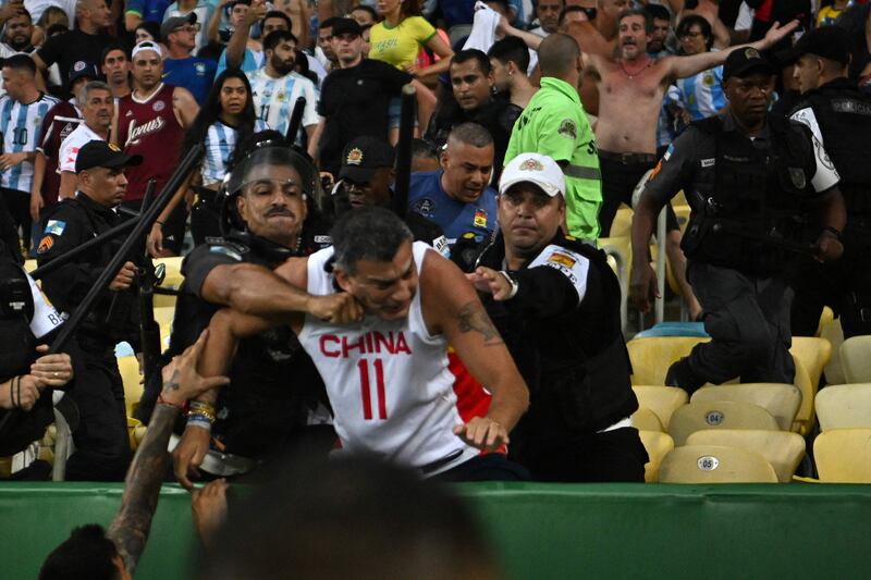 Argentina fans clash with Brazilian police before the start of the match. AFP