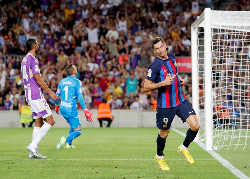 Robert Lewandowski celebrates scoring Barcelona's third goal. Reuters