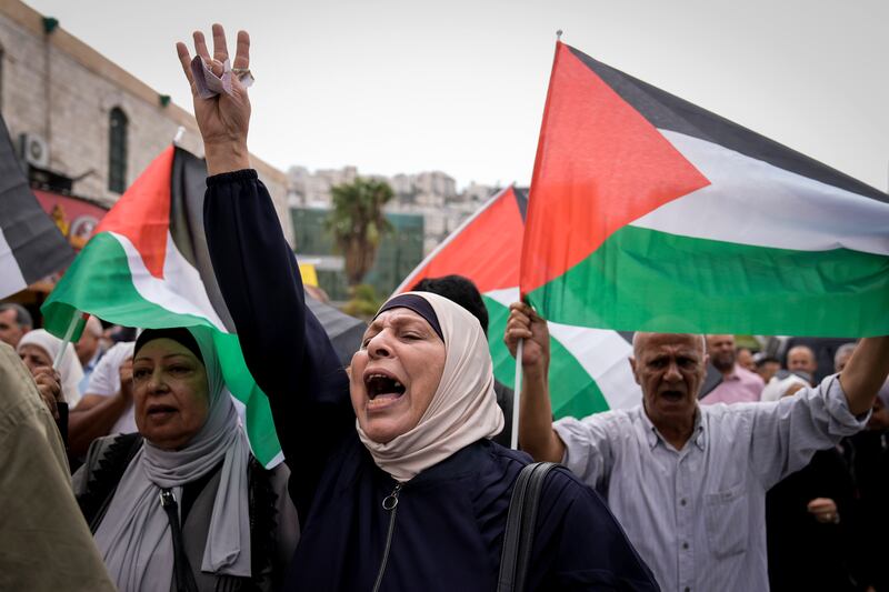 Palestinians attend a rally in support of Hamas and the Gaza Strip in the West Bank city of Nablus. AP