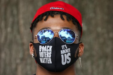 A voting rights activist in Atlanta, Georgia. Voters in non-white communities in Georgia often face long queues at polling stations. Reuters 