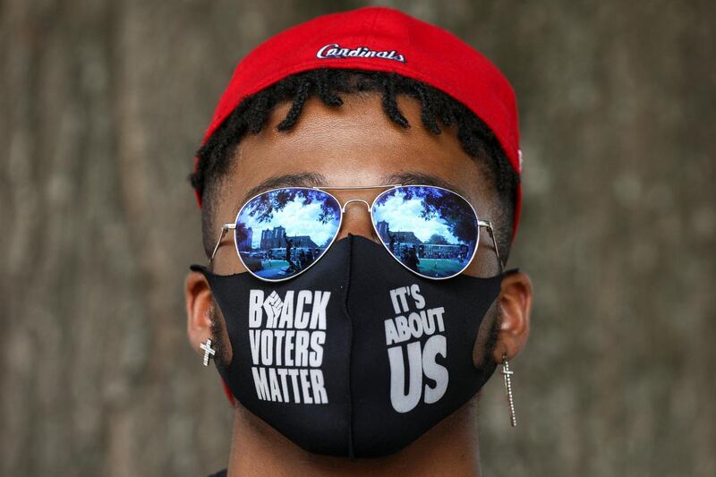 Historic Ebenezer Baptist Church is reflected in a man?s sunglasses during a stop on the Freedom Ride For Voting Rights at Ebenezer Baptist Church in Atlanta, Georgia, U.S. June 21, 2021.  REUTERS/Dustin Chambers