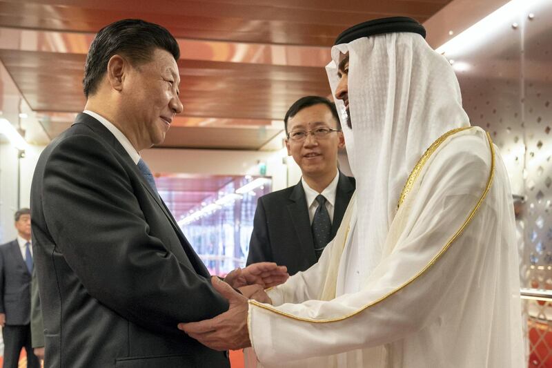 Sheikh Mohamed bin Zayed embracing Xi Jinping during the Chinese leader's state visit to the UAE in 2018. Mohamed Al Hammadi / Crown Prince Court - Abu Dhabi