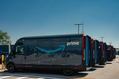 Amazon delivery electric vans, built by Rivian Automotive, outside the company's logistics warehouse in Chicago. Bloomberg