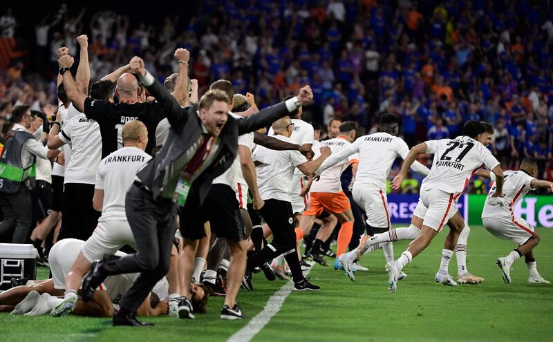 Frankfurt playes and staff celebrate after winning the Europa League final. AFP