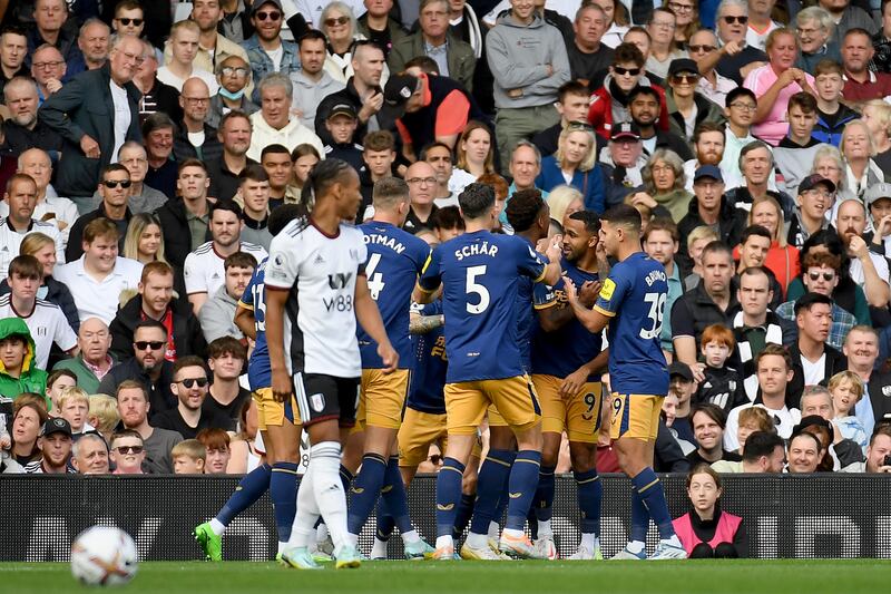 Callum Wilson of Newcastle United celebrates with teammates after scoring the first goal. Getty