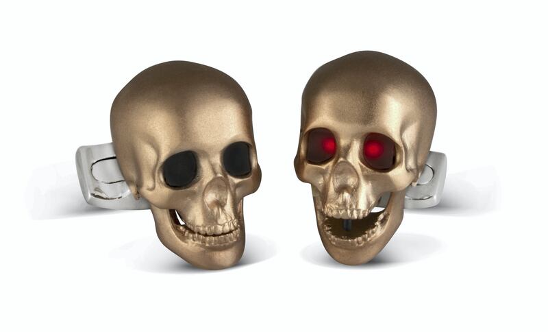 Skull cufflinks with LED eyes in rose gold satin finish; Dh1,450