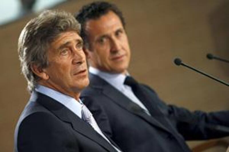 Manuel Pellegrini, left, is officially unveiled today as thew new coach of Spanish giants Real Madrid by the club's new director Jorge Valdano.