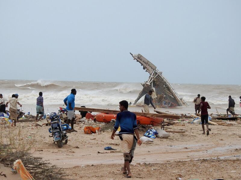 People search among the wreckage of a boat destroyed by Cyclone Mekunu in Socotra Island, Yemen, May 25, 2018. Picture taken May 25, 2018. REUTERS/Stringer NO RESALES. NO ARCHIVES.