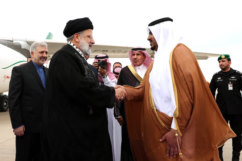 Iranian President Ebrahim Raisi, left, is received at the airport in Riyadh. Mr Raisi is in Saudi Arabia to attend the Organisation of Islamic Countries leaders' summit on Palestine and will likely meet high-ranking Saudi officials for the first time since the restoration of bilateral ties between Tehran and Riyadh. EPA