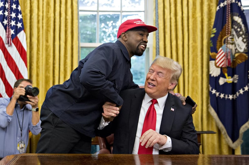 Rapper Kanye West, left, shakes hands with U.S. President Donald Trump during a meeting in the Oval Office of the White House in Washington, D.C., U.S., on Thursday, Oct. 11, 2018. West, a recording artist and prominent Trump supporter, is at the White House to have lunch with the president and to meet with presidential son-in-law and senior adviser Jared Kushner who has spearheaded the administrations efforts overhaul the criminal justice system. Photographer: Andrew Harrer/Bloomberg