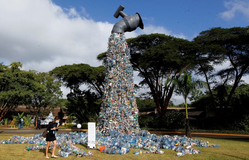 A delegate looks at a sculpture made from plastic waste during the UN Environment Assembly in Nairobi, Kenya. Reuters