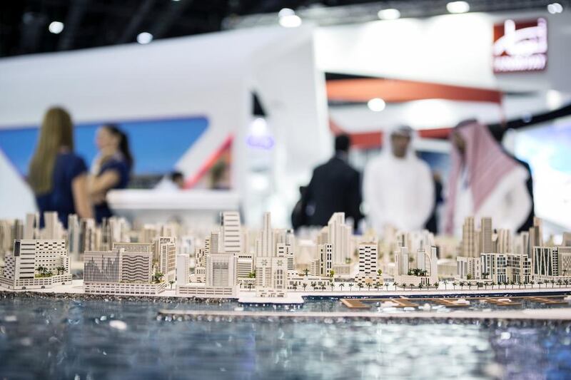 Above, a model of the Sharjah Waterfront City showcased by Sharjah Oasis Real Estate Development at Cityscape Global in Dubai. Reem Mohammed / The National