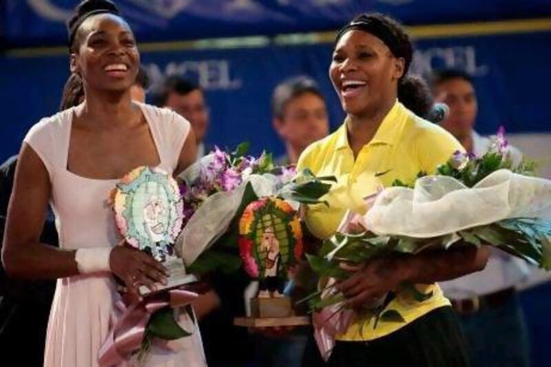 Venus, left, and Serena have won 20 grand slams between them and yesterday both were picked for the US Olympic team. Raul Aroboleda / AFP