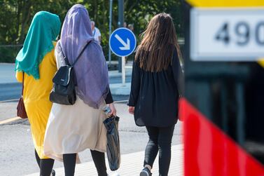 Two young women wearing headscarves at Germany's border with Poland. Getty Images 