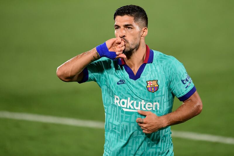 Luis Suarez celebrates after scoring a goal against Villarreal on July 5. AFP