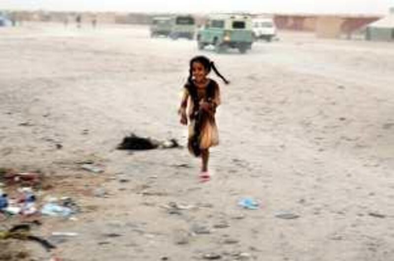 April 19, 2009 / Algeria /  A Saharawi girl runs through the middle of the street in a Saharawi refugee camp April 19, 2009. In 1975 Morocco annexed most of territory when Spain, it's coloniser, withdrew. Around half of the native Saharawis fled to Algeria, where they still live in camps run by the Polisario, Western Sahara's Algerian-backed liberation front. The fighting between Morocco and Polisario has cooled, but the conflict is still unresolved. Now the parties and the UN are gearing up for a new attempt, since solving Western Sahara is the key to undoing the mini cold-war between Morocco and Algeria that has crippled the region for years. (Sammy Dallal / The National)
 *** Local Caption ***  sd-041409-tinfouk-06.JPG