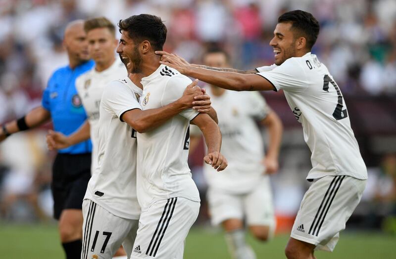 Real Madrid's Marco Asensio celebrates his goal with Lucas Vazquez. AP Photo