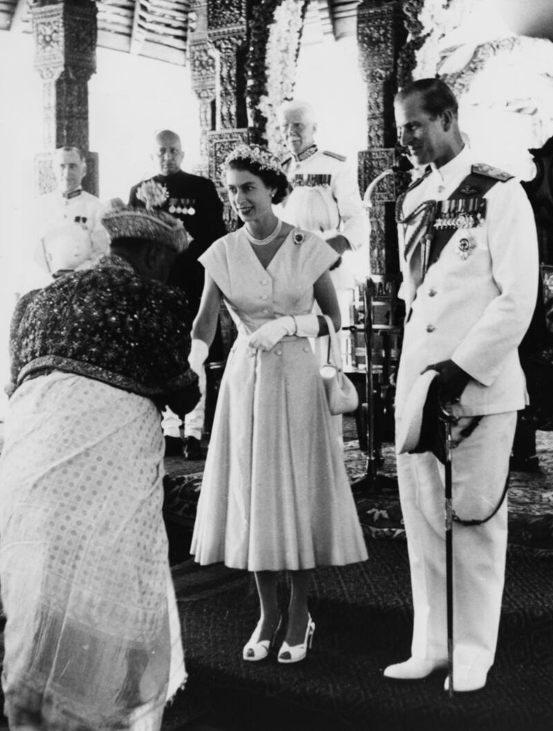 Queen Elizabeth II and Prince Philip being welcomed by a Kandyan Chief during their Royal Tour in Kandy, April 23rd 1954. (Photo by Central Press/Hulton Archive/Getty Images)