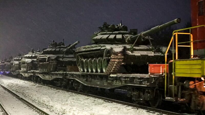 Russian army tanks are loaded on to railway platforms to move back to their permanent base after drills in Russia. AP Photo