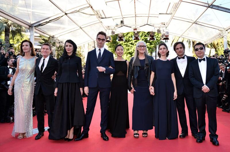 New Zealander director and President of the Feature films Jury Jane Campion (fourth right) poses with the members of the Jury (from left) French actress Carole Bouquet, US actor Willem Dafoe, Iranian actress Leila Hatami, Danish director Nicolas Winding Refn, South Korean actress Jeon Do-yeon, US director Sofia Coppola, Mexican actor and director Gael Garcia Bernal and Chinese director Jia Zhangke. AFP

