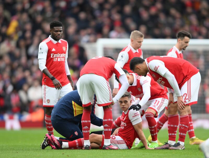 Arsenal's Leandro Trossard recieves treatment for an injury that woyuld see his match ended in first half. EPA