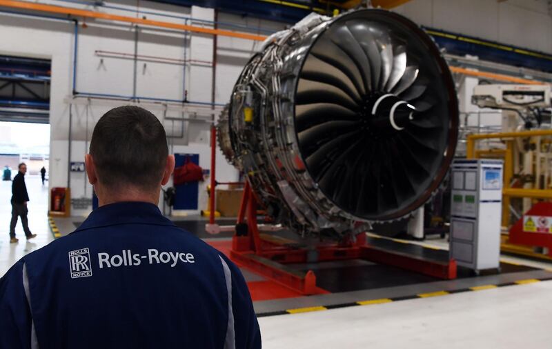(FILES) This file photograph taken on November 30, 2016, shows a Rolls Royce Trent XWB engine on view on the assembly line at the Rolls Royce factory in Derby, central England. The engine manufacturer Rolls-Royce, in difficulty because of the crisis in the airline sector generated by the coronavirus Covid-19 pandemic, announced on October 1, 2020, a recapitalization plan of 5 billion pounds sterling. / AFP / POOL / PAUL ELLIS
