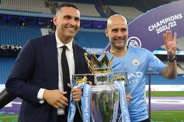 Manchester City's Spanish manager Pep Guardiola and Manchester City Emirati chairman Khaldoon al-Mubarak (L) celebrate with the Premier league trophy on the pitch after the English Premier League football match between Manchester City and Aston Villa at the Etihad Stadium in Manchester, north west England, on May 22, 2022.  - Manchester City won the Premier League for the fourth time in five seasons after a pulsating title race reached a dramatic conclusion as the champions staged an incredible comeback from two goals down to beat Aston Villa 3-2 on Sunday.  (Photo by Oli SCARFF / AFP) / RESTRICTED TO EDITORIAL USE.  No use with unauthorized audio, video, data, fixture lists, club/league logos or 'live' services.  Online in-match use limited to 120 images.  An additional 40 images may be used in extra time.  No video emulation.  Social media in-match use limited to 120 images.  An additional 40 images may be used in extra time.  No use in betting publications, games or single club/league/player publications.   /  