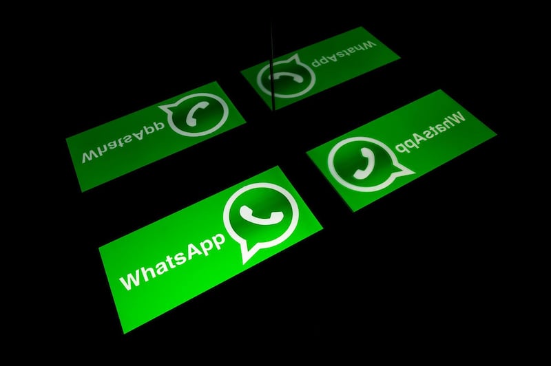 (FILES) In this file photo taken on October 05, 2020 the logo of mobile messaging service WhatsApp on a tablet screen in Toulouse, southwestern France. WhatsApp on December 8, 2020 added virtual shopping carts people can load with purchases and then use to fire off orders to businesses as the Facebook-owned messaging service pushed deeper into e-commerce. / AFP / Lionel BONAVENTURE
