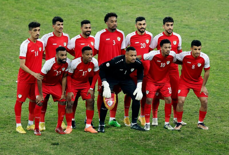 Oman players pose for a team photo before the match. Reuters