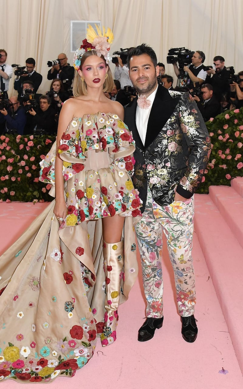Josephine Skriver was dressed like a modern day Little Bo Peep, while her (unnamed) companion outshone her in artfully mismatched florals.  AFP
