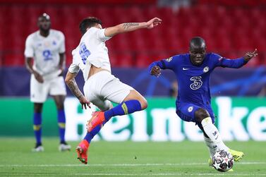 N'Golo Kante of Chelsea competes for the ball with Mateus Uribe of Porto during their Uefa Champions League quarter-final, second-leg match at Estadio Ramon Sanchez Pizjuan in Seville, Spain, on April 13, 2021. Getty Images