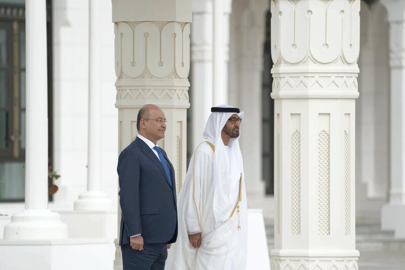 ABU DHABI, UNITED ARAB EMIRATES - November 12, 2018: HH Sheikh Mohamed bin Zayed Al Nahyan Crown Prince of Abu Dhabi Deputy Supreme Commander of the UAE Armed Forces (R) and HE Dr Barham Salih, President of Iraq (L), stand for the national anthem, during a reception held at the Presidential Palace.

( Mohamed Al Hammadi / Ministry of Presidential Affairs )
---