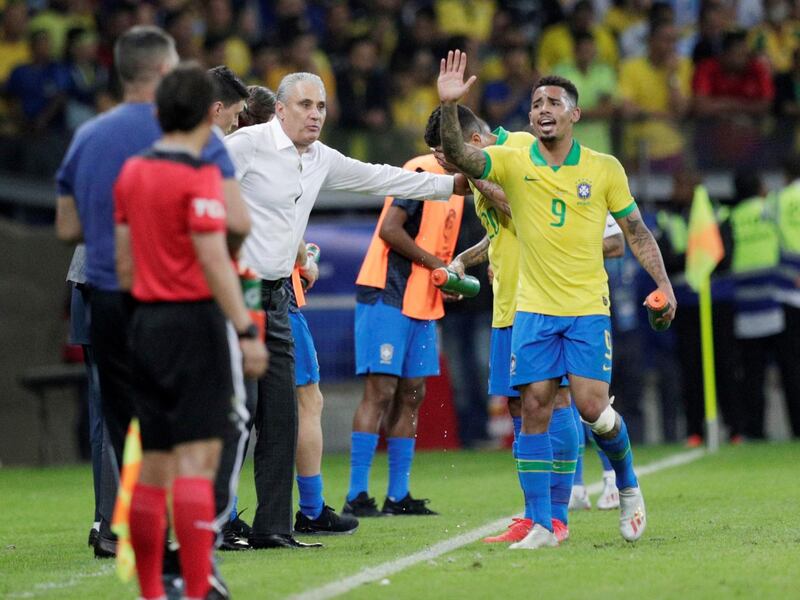 Brazil coach Tite and Brazil's Gabriel Jesus. Reuters