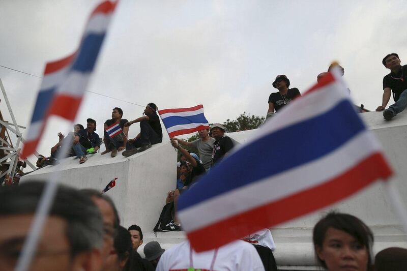 Protesters gather with Thai national flags at an anti-government rally, calling for Thai Prime Minister Yingluck Shinawatra to step down, in Bangkok, Thailand. Wason Wanitchakorn / AP Photo