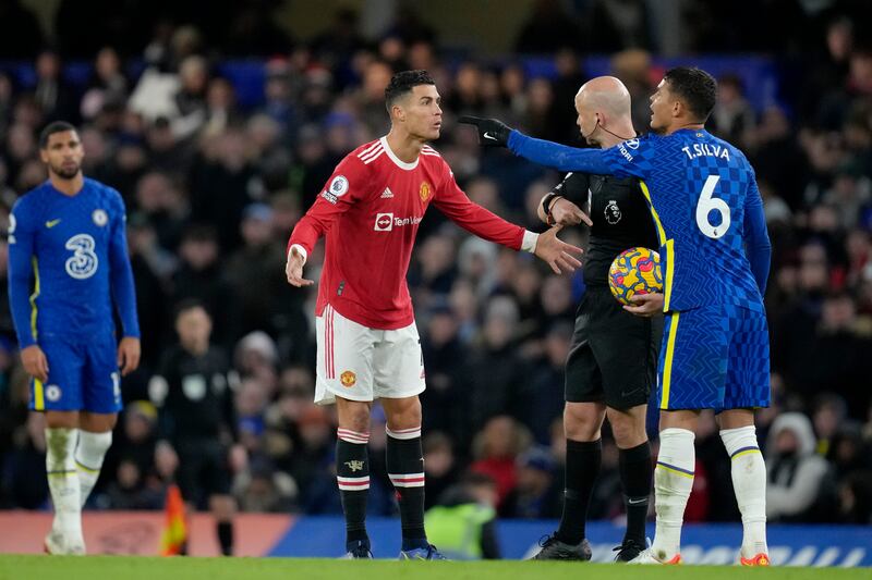 Cristiano Ronaldo talks to referee Anthony Taylor while Chelsea's Thiago Silva, right, gestures. AP