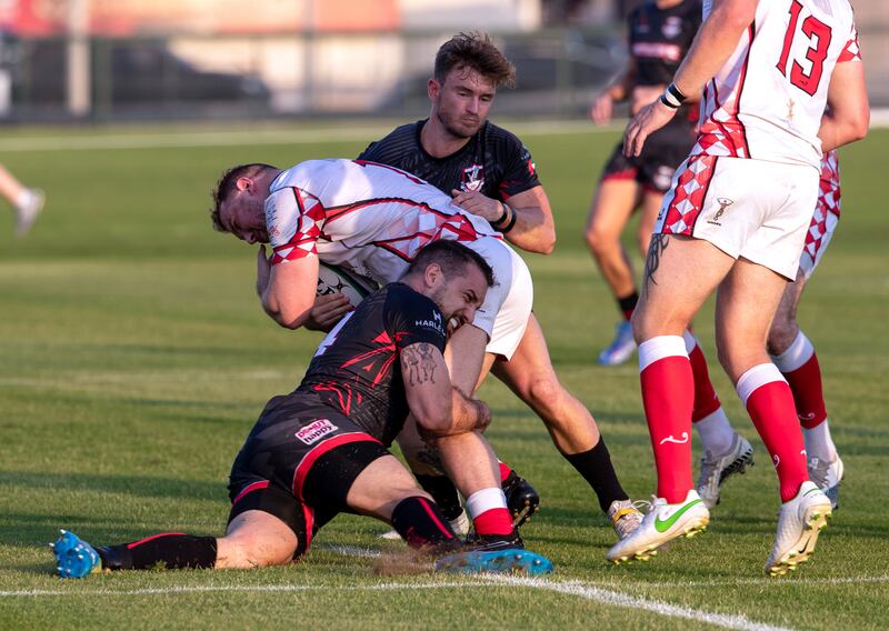 Premiership, Abu Dhabi Harlequins (white)vs. Dubai Exiles (black) at Zayed Sports City rugby fields.