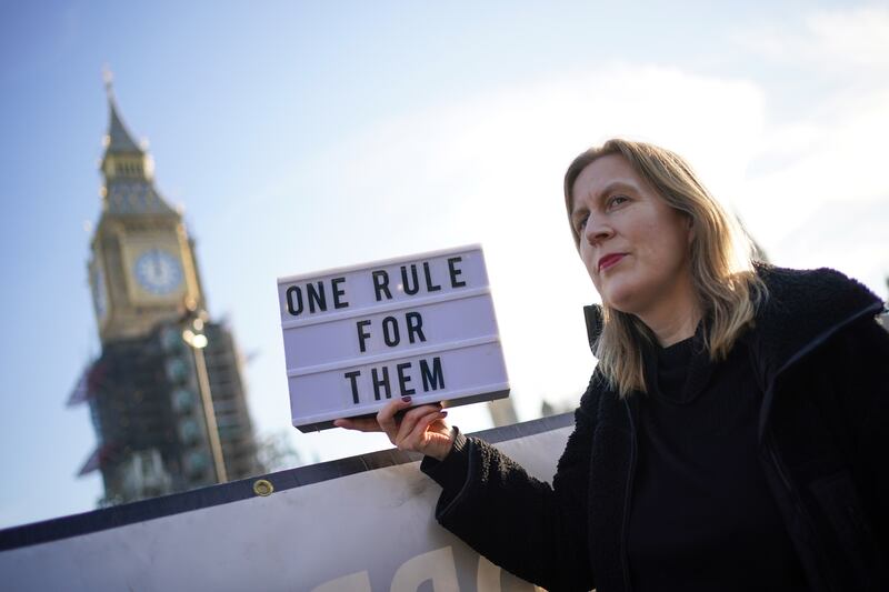 During Boris Johnson's apology at Parliament, protesters gathered in Parliament Square in Westminster, central London. PA