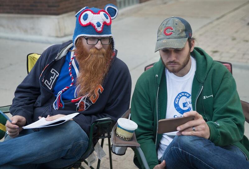 Dude, has anyone bid on my hat collection? I’m stressing out here. Scott Olson / Getty Images / AFP