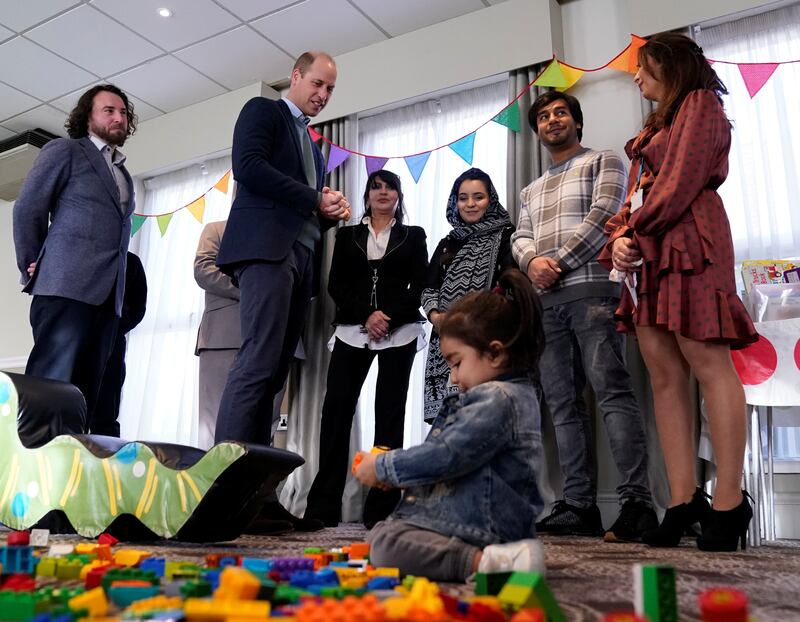 Britain's Prince William meets people evacuated from Afghanistan, who are now living in a hotel in Leeds. Reuters