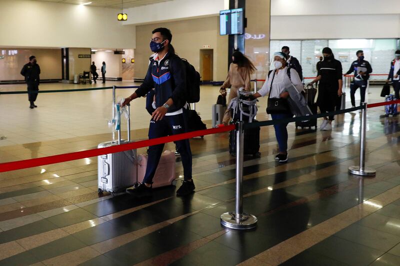 India's National Cricket team members arrive at the OR Tambo International Airport in Johannesburg, on December 16, 2021 at the start of their 2021-2022 Tour of South Africa .  (Photo by Phill Magakoe  /  AFP)