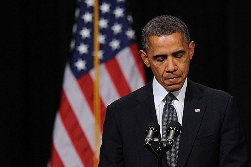 Barack Obama, the US president, pauses during his speech at the Sandy Hook Elementary School shooting at Newtown High School .
